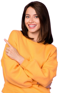 A smiling student holding books and a backpack
